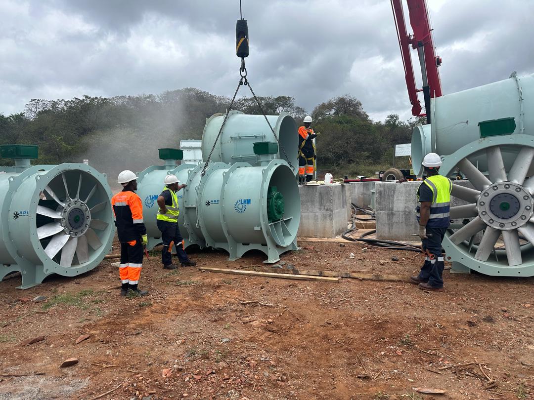 ADC team inspection — multiple fan units before crane operations 