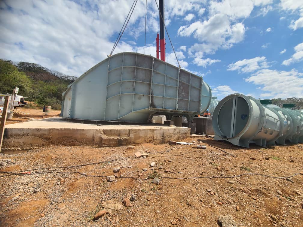 Fan volute seated on foundation with units staged behind